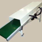 Convoyeur avec aspiration de particules